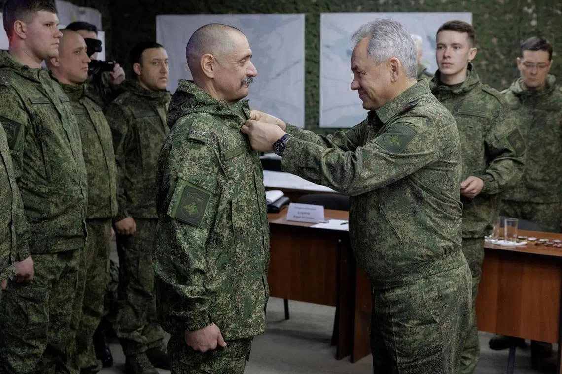 Russia's Defence Minister Sergei Shoigu hands out awards at what his ministry termed a forward command post in an undisclosed part of Ukraine.