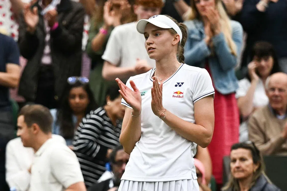 Kazakhstan's Elena Rybakina applauds Anna Kalinskaya leaving Centre Court after the Russian retired from their women's singles tennis match on July 8.