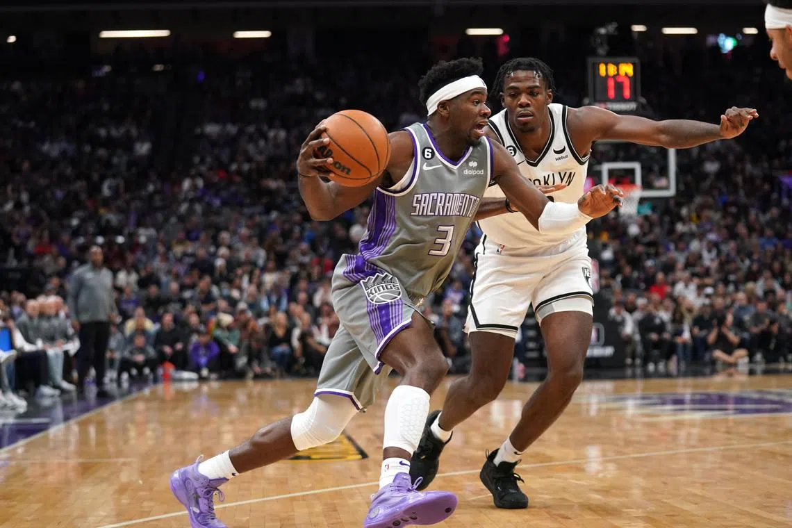 Sacramento Kings guard Terence Davis dribbling past Brooklyn Nets centre Day'Ron Sharpe in the fourth quarter at the Golden 1 Centre on Tuesday. Davis amassed a game-high and season-best 31 points off the bench to help his team to a 153-121 win.