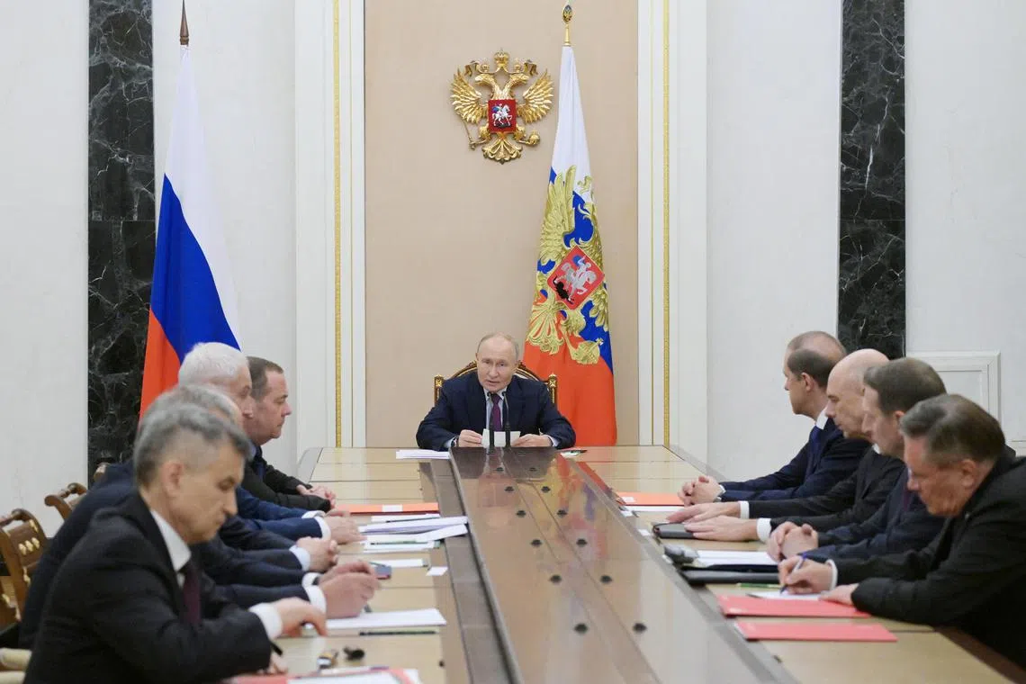 President Vladimir Putin chairing a meeting of Russia's Security Council on the subject of nuclear deterrence in Moscow, on Sept 25.