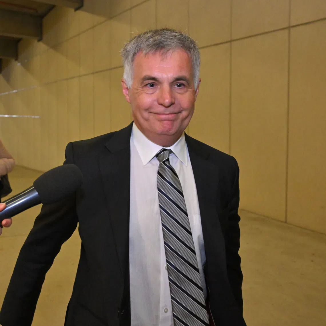 Optus Chief Executive Officer Stephen Rue arrives at Parliament House in Canberra for a meeting with Australian Communications Minister Anika Wells on Oct 7, 2025. PHOTO: EPA
