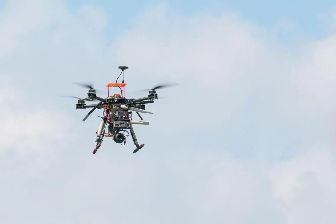 A drone hovers ahead of a drone competition at the National Formosa University in Yunlin.