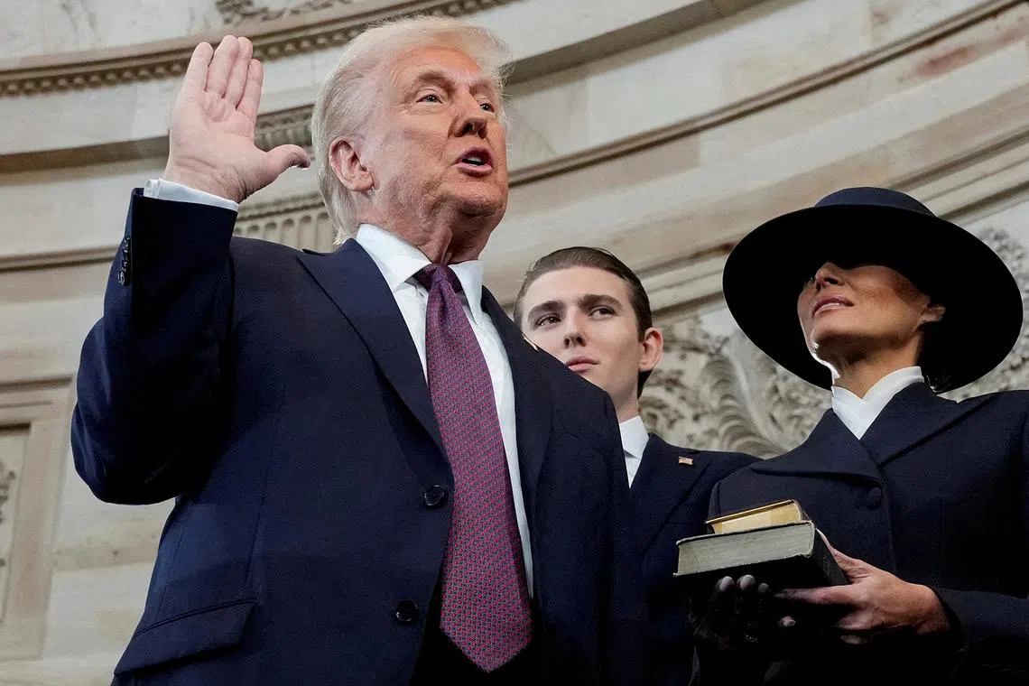 Donald Trump is sworn in as the 47th President of the United States by Chief Justice John Roberts as Melania Trump holds the Bible during the 60th Presidential Inauguration in the Rotunda of the U.S. Capitol in Washington on Jan 20, 2025. 