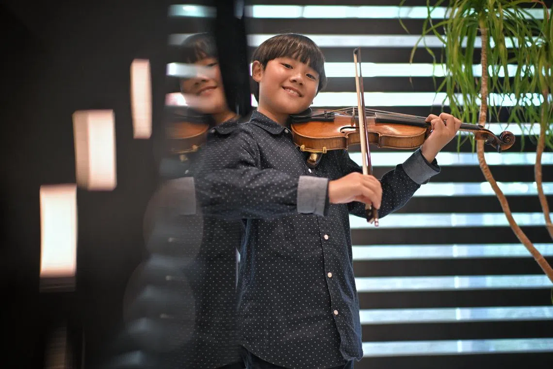ST20240612_202412194749/hsviolin14/Shintaro Tay/Chin Hui Shan/

Nine-year-old Travis Wong pictured on June 12, 2024. 

He was the overall winner for prestigious competition International Violin Competition “Andrea Postacchini” 2024. He was previously featured on ST for achieving distinction in the Grade 8 -  the highest level before the suite of diplomas - violin performance examination conducted by London-based Associated Board of the Royal Schools of Music (ABRSM) in 2021 at the age of 5. He also recently performed at the Carnegie Hall in New York after winning another competition prior.