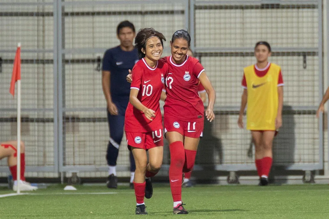 Singapore's Farah Nurzahirah (left) celebrating her goal with teammate Dhaniyah Qasimah against Pakistan in their friendly at the Jalan Besar Stadium on Tuesday.

PHOTO: FOOTBALL ASSOCIATION OF SINGAPORE