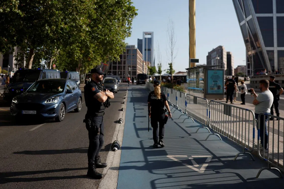 Police officers work near the area where Begona Gomez, wife of Spanish Prime Minister Pedro Sanchez, arrives to a court to appear before a judge to testify over allegations of corruption and influence in Madrid, Spain July 5, 2024. REUTERS/Juan Medina