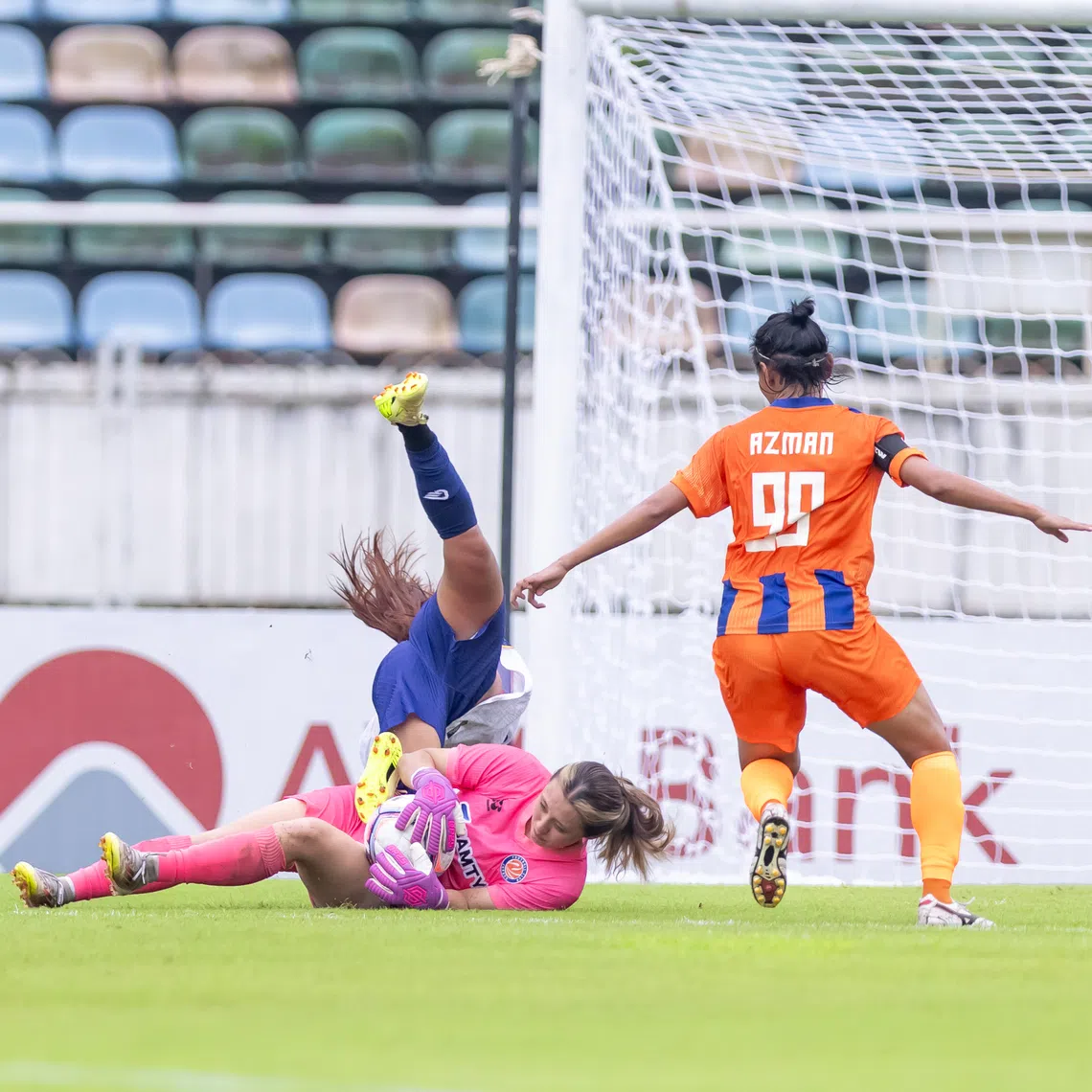 FC Jurong goalkeeper Hazel Lim coming out to claim the ball during an AFC Women’s Champions League preliminary-stage match against Ayeyawady FC  in Myanmar on Aug 17.