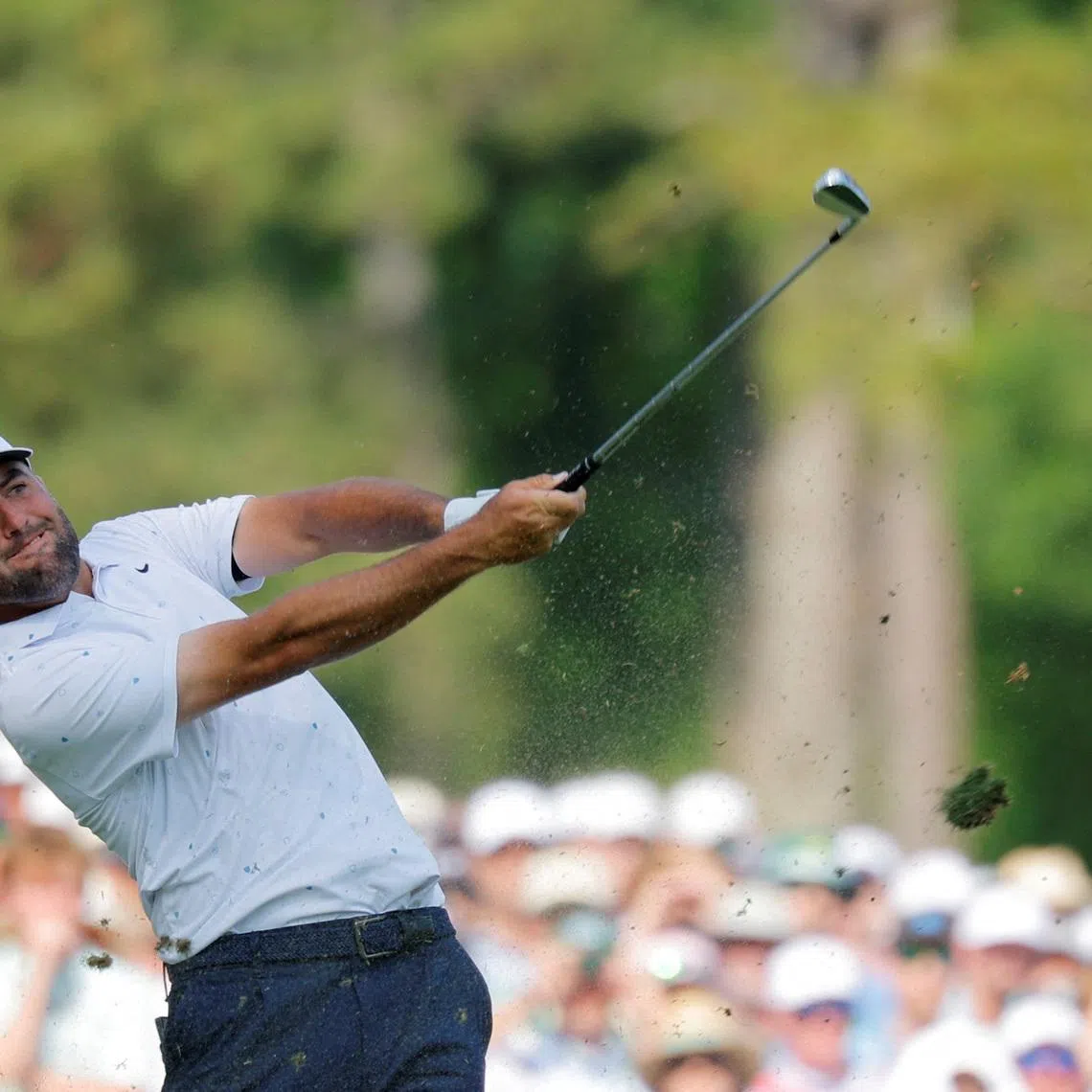 Golf - The Masters - Augusta National Golf Club, Augusta, Georgia, U.S. - April 12, 2026  Scottie Scheffler of the U.S. hits his tee shot on the 12th hole during the final round REUTERS/Mike Blake