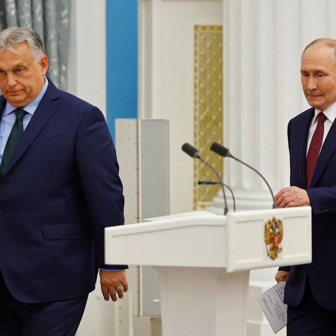 Hungary's Prime Minister Viktor Orban and Russia's President Vladimir Putin arrive for a press conference following their meeting in Moscow, Russia July 5, 2024. REUTERS/Evgenia Novozhenina