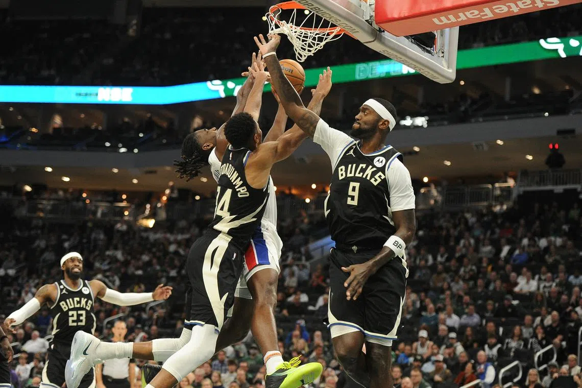 Detroit Pistons centre Isaiah Stewart drives to the basket against Milwaukee Bucks forward Giannis Antetokounmpo.