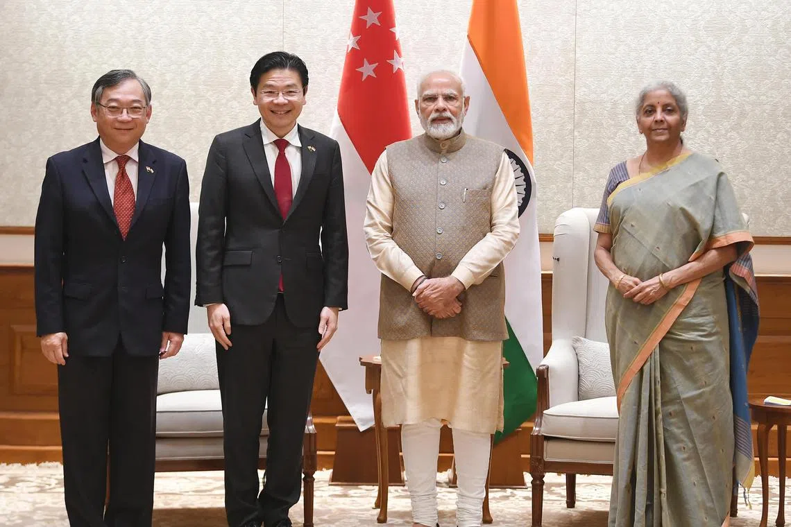 Singapore Prime Minister Lawrence Wong (second from left) congratulated Mr Narendra Modi (second from right) on the latter's "historic win" in India's massive election. They met during Mr Wong's official visit to India in 2022. 