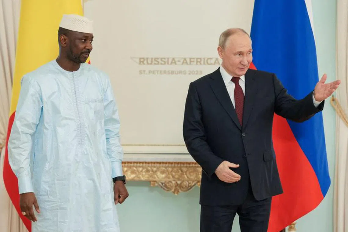 FILE PHOTO: Russia's President Vladimir Putin shows the way to Mali's President Assimi Goita during a meeting following the Russia-Africa summit in Saint Petersburg, Russia, July 29, 2023. Mikhail Metzel/TASS Host Photo Agency via REUTERS/File Photo