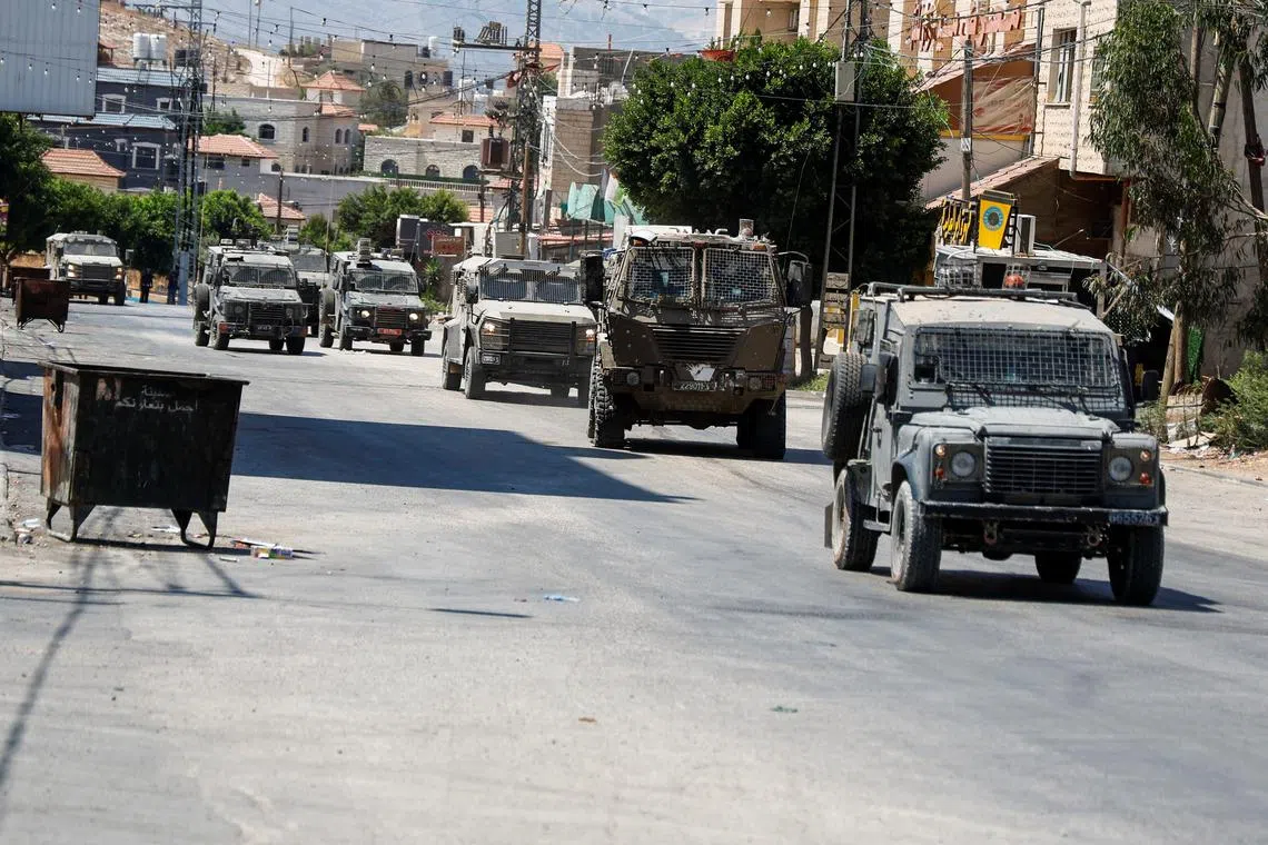 Israeli military vehicles in Tubas, in the Israeli-occupied West Bank, during a raid on Aug 14.
