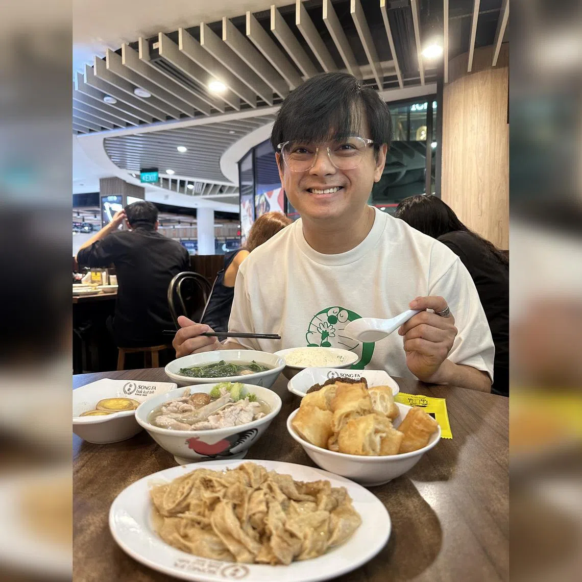 Dennis Chew savours his weekly bowl of bak kut teh with some braised fried beancurd, a braised egg and a bowl of white rice.