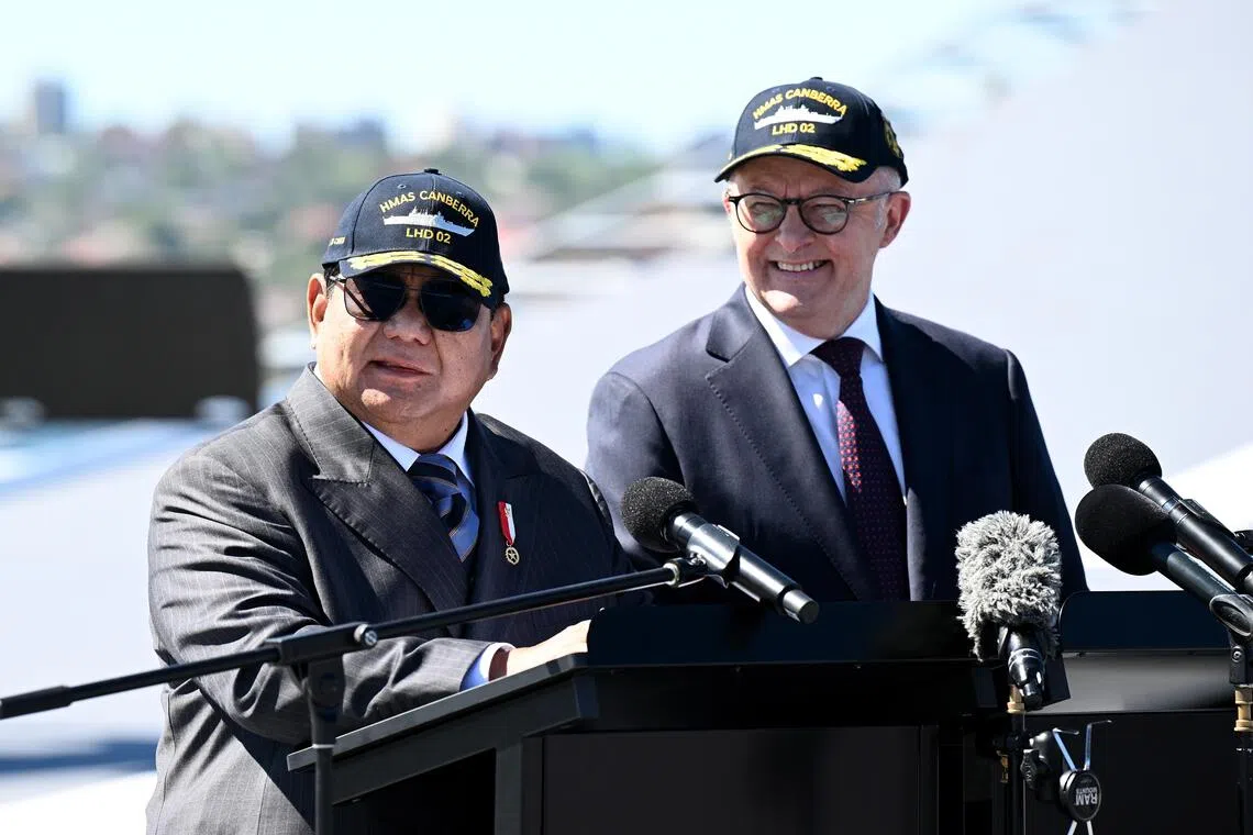 Australian Prime Minister Anthony Albanese (R) and Indonesian President Prabowo Subianto aboard HMAS Canberra at Fleet Base East, Sydney, on Nov 12, 2025. PHOTO: EPA