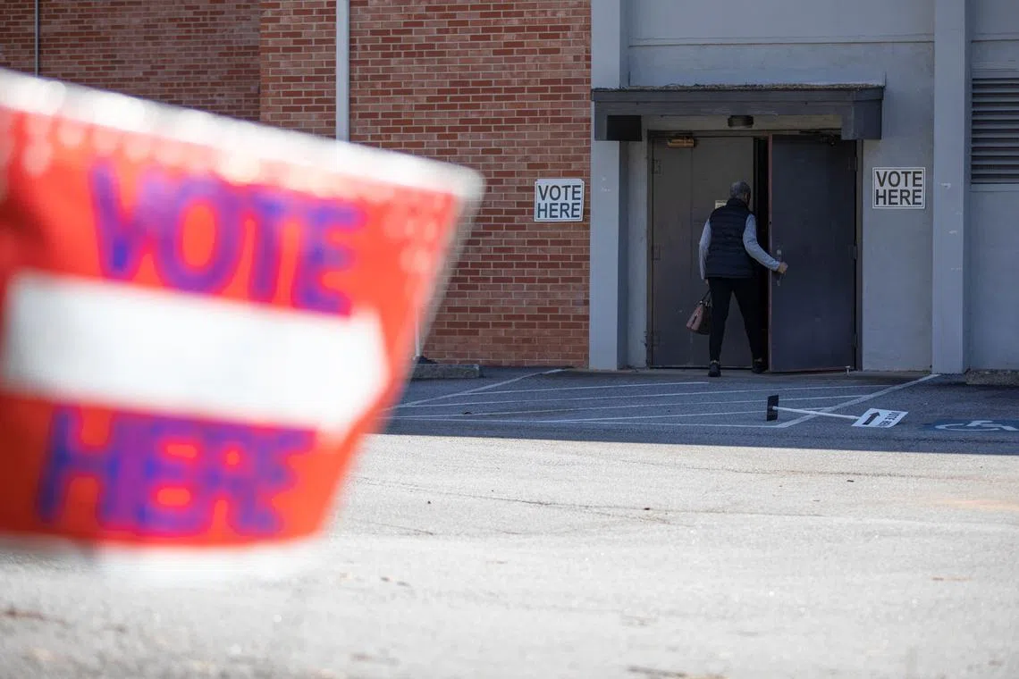 FILE PHOTO: A Cobb County resident enters the King Spring Baptist Church voting precinct to cast their ballot during the Georgia Presidential Primary Election, in Smyrna, Georgia, U.S., March 12, 2024.  REUTERS/Alyssa Pointer/File Photo