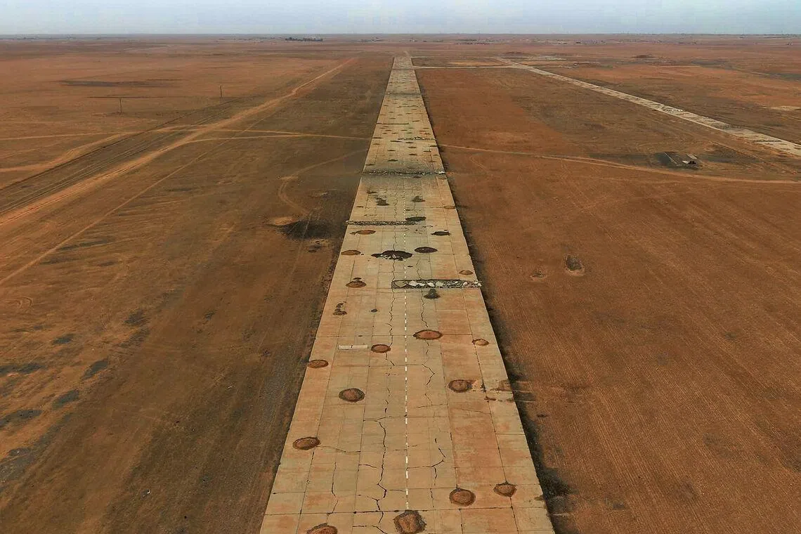 This aerial photograph taken on Jan 22, 2026 shows damaged runway of the military airport in Tabqa, in Syria's Raqa province. Government troops drove Kurdish forces from two Aleppo neighbourhoods last week and took control of an area east of the city. 