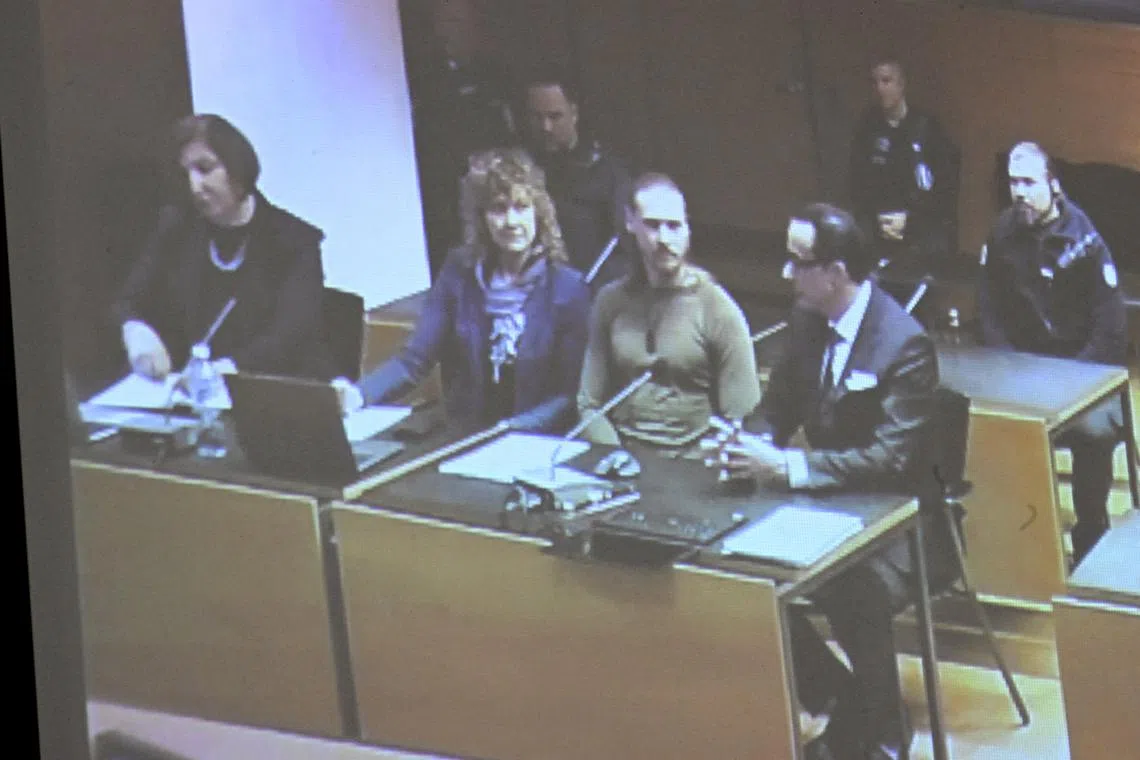 FILE PHOTO: Yan Petrovsky, also known as Voislav Toden, an ex-commander of the Russian far-right extremist Rusich paramilitary group, who is suspected of committing war crimes in Ukraine, attends a trial, as projected on a screen, in Helsinki, Finland December 5, 2024. Lehtikuva/Heikki Saukkomaa via REUTERS/File Photo