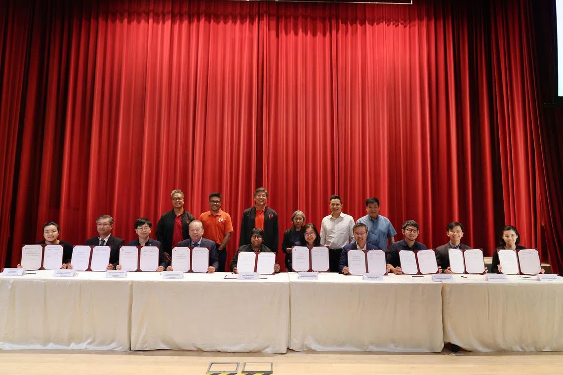 Ms K. Thanaletchimi (front row, centre), president of both NTUC and HSEU, and representatives of nine healthcare professional associations in Singapore, signed nine memorandums of understanding to mark the formation of a new Healthcare Professional Community on Sept 30. The ceremony was witnessed by NTUC secretary-general Ng Chee Meng (back row, centre). 