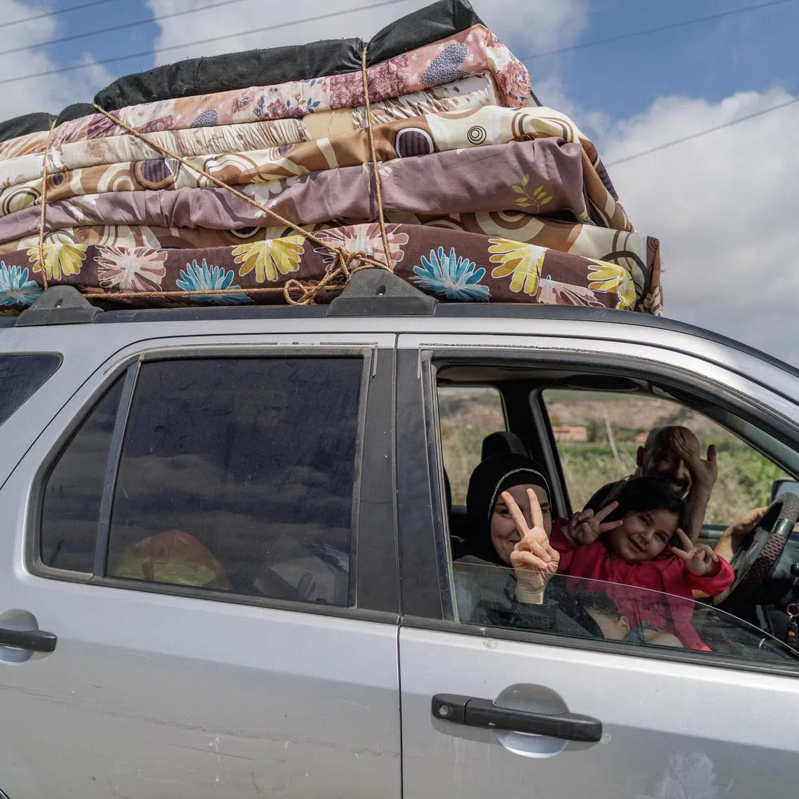 Displaced people react, as they make their way back to their home in southern Lebanon following an interim deal between the U.S. and Iran, in Qasmiyeh, Tyre district, Lebanon, June 21, 2026. REUTERS/Zohra Bensemra
