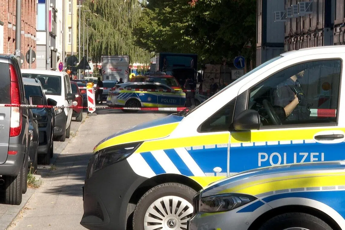 Police securing the area on Sept 3, in Munich, Germany, after what is thought to be a politically motivated arson attack at the headquarters of defence technology firm Rohde & Schwarz.