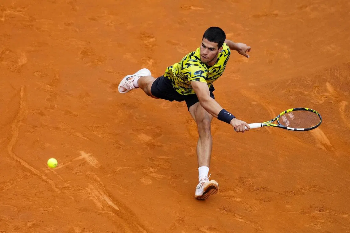 Carlos Alcaraz in action against Nuno Borges at the Barcelona Open.