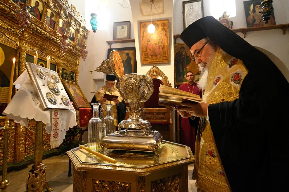 Greek Orthodox Patriarch of Jerusalem Theophilos III participates in the mixing of the oils from the Mount of Olives to make Chrism Oil, which will be used in the coronation of Britain's King Charles.
