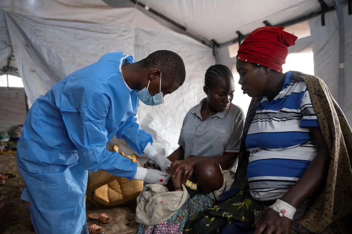 FILE PHOTO: A Congolese nurse takes a sample from a suspected mpox patient in the treatment centre at the Kavumu hospital in Kabare territory, South Kivu province of the Democratic Republic of Congo, August 29, 2024. REUTERS/Arlette Bashizi/File Photo