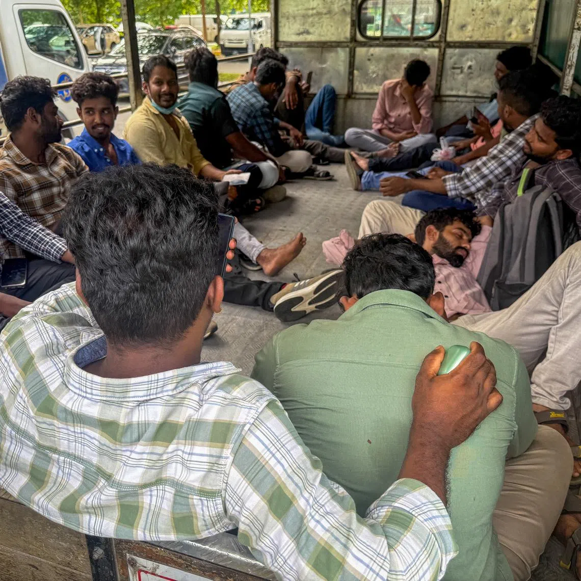 Workers from air-con services company KPA Engineering in a lorry near the MOM Services Centre in Bendemeer on June 23.