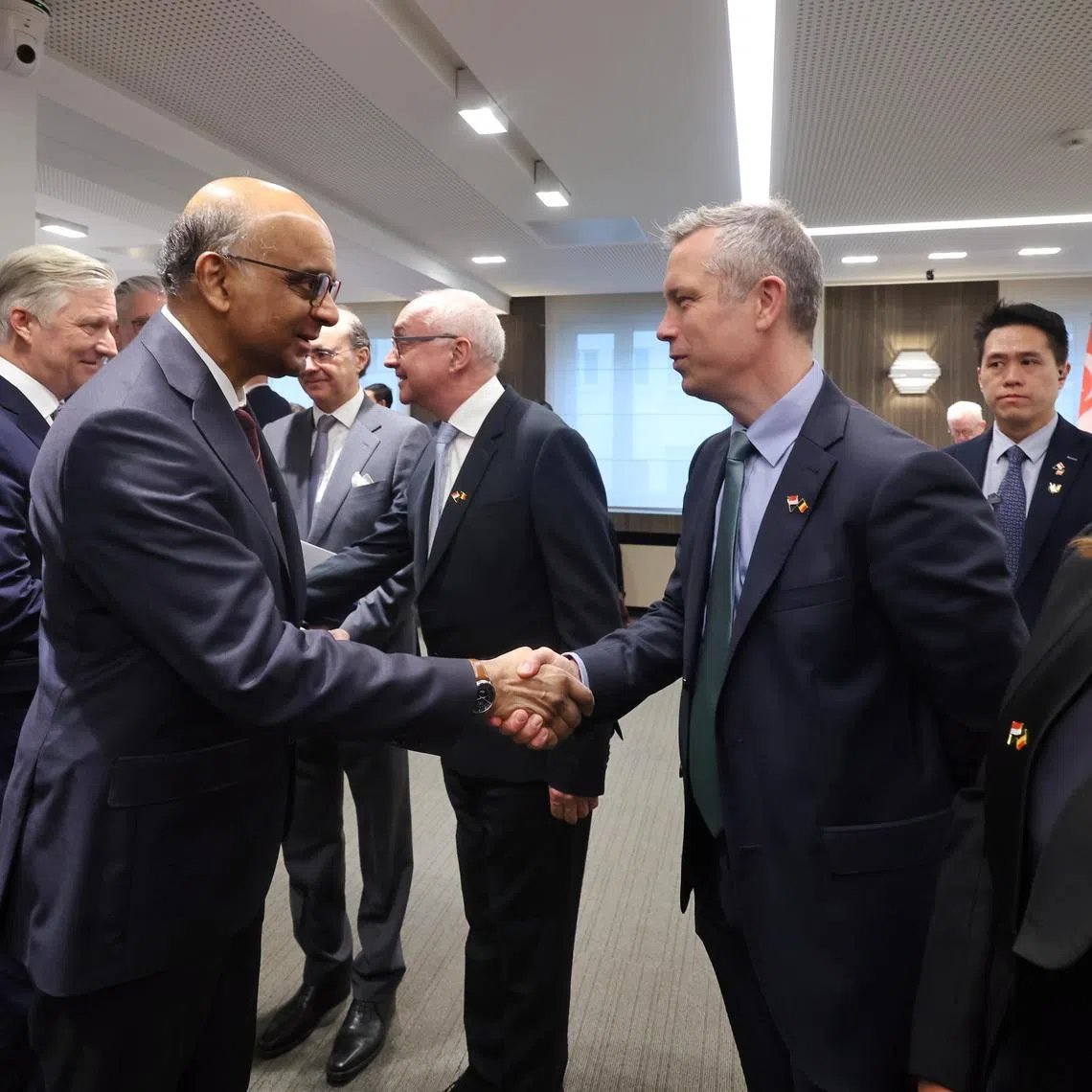 President Tharman Shanmugaratnam meeting Mr Benoit van den Hove, CEO of Euronext Brussels, alongside Belgium's King Philippe (left), at a breakfast dialogue in Brussels on March 26.