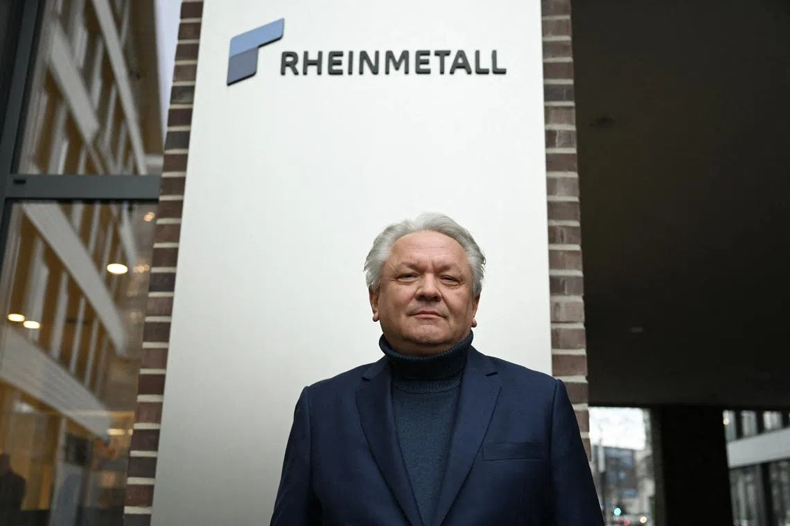 FILE PHOTO: Armin Papperger, CEO of German defense and automotive group Rheinmetall AG poses in front of the company's logo and headquarters following a Reuters interview in Duesseldorf, Germany January 27, 2023. REUTERS/Jana Rodenbusch/File Photo