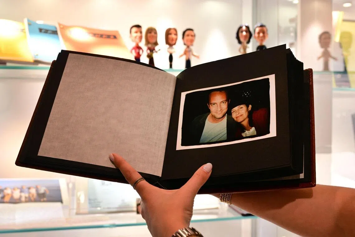 A photo album given by actress Jennifer Aniston to fellow Friends cast members Matthew Perry and Courteney Cox, is displayed ahead of The Matthew Perry Estate Auction at Heritage Auctions in Beverly Hills, California, on May 19, 2026. 