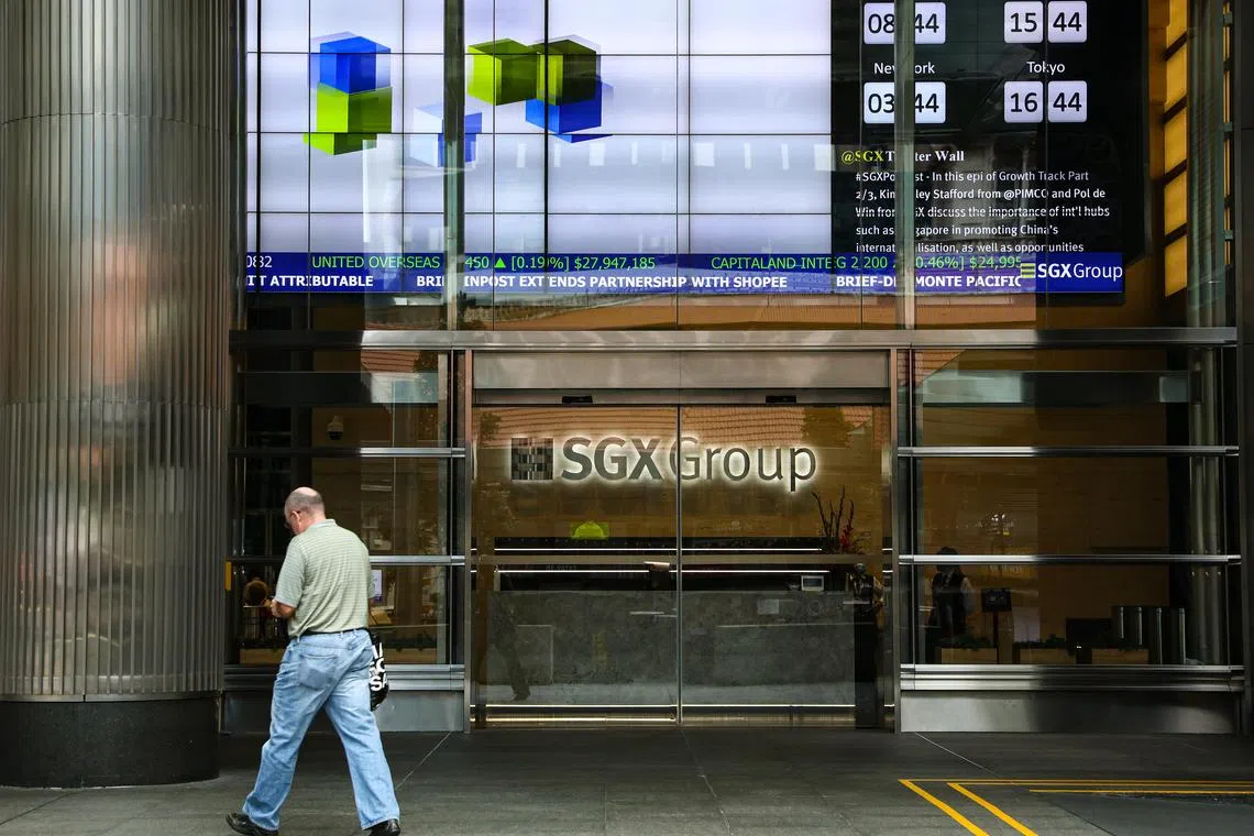 A man walks in front of the Singapore Exchange building (SGX) on July 21, 2022.