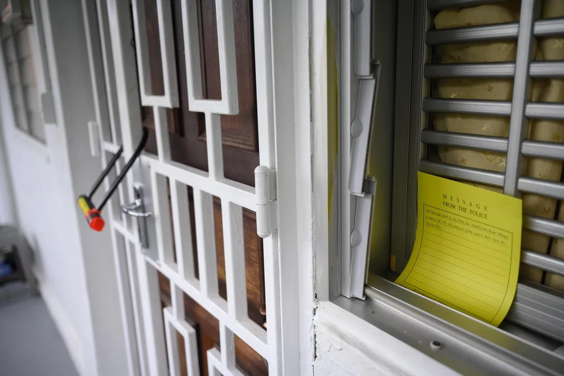 A note placed by the police telling people not to remove the lock outside the unit at Block 125 Ang Mo Kio Avenue 6 where a 66-year-old man was arrested for a suspected murder, on Nov 29.