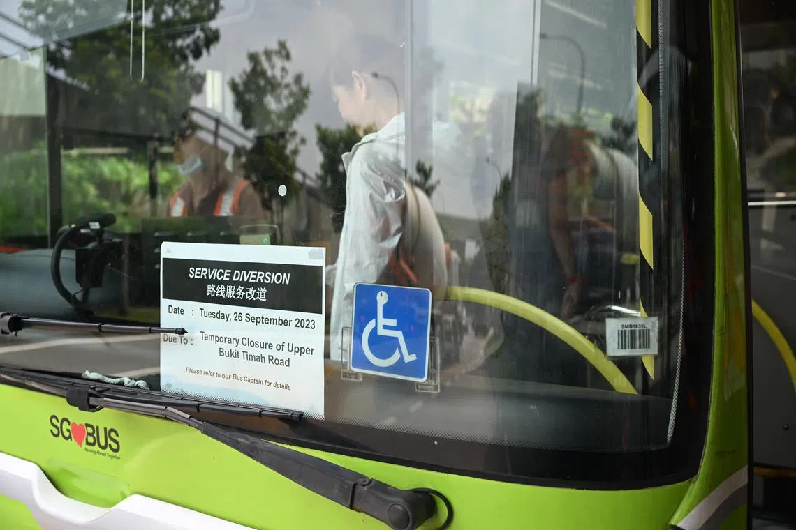A service diversion sign is seen on a bus on Sept 26. 
