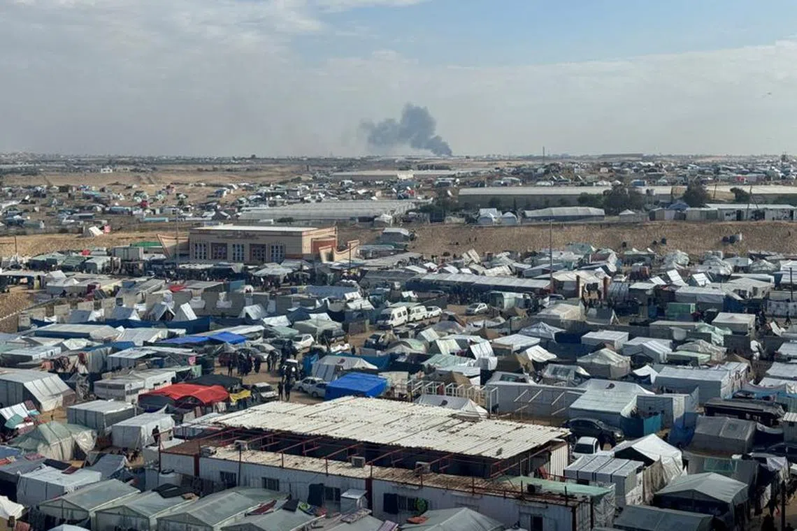FILE PHOTO: Smoke rises during an Israeli ground operation in Khan Younis, amid the ongoing conflict between Israel and Hamas, as seen from a tent camp sheltering displaced Palestinians in Rafah, in the southern Gaza Strip, January 25, 2024. REUTERS/Bassam Masoud/File Photo