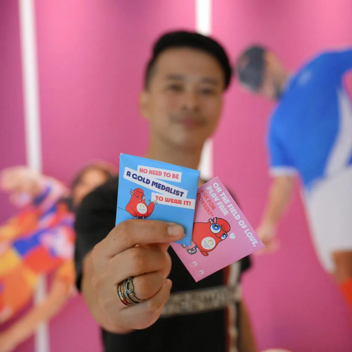 The Straits Times sports correspondent David Lee with Athlete issued condom from the Olympic Village during the Paris 2024.