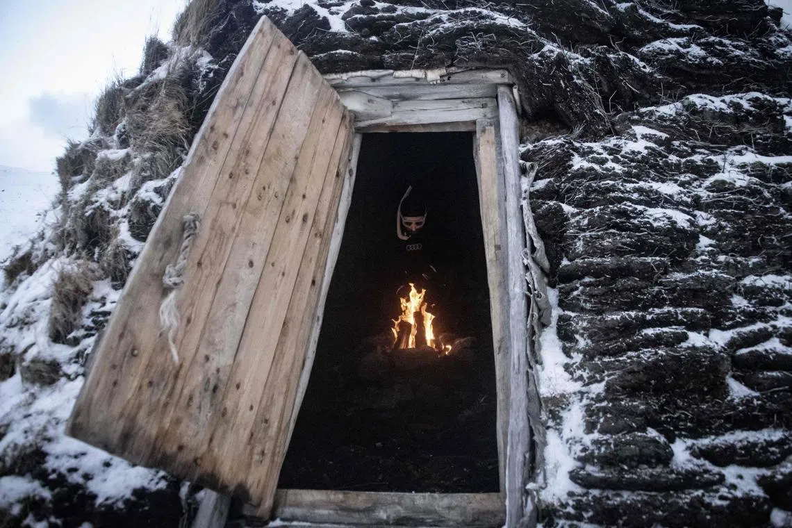 Five times freediving World Champion France's Arthur Guerin-Boeri warm up in an old traditional artic Huts, before dives in the deep to spot Orcas (Killer Whales), in the Spildra Island northern Arctic Circle, on Jan 26, 2023. 