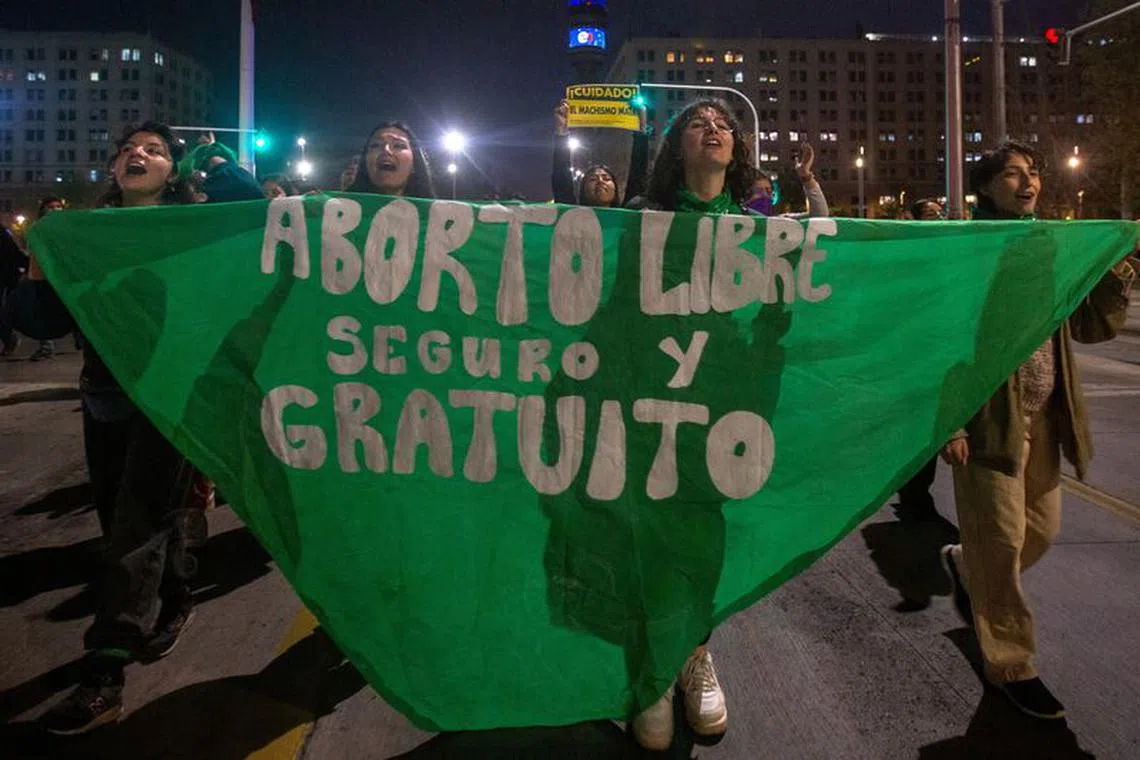 Demonstrators hold a banner during a rally to mark International Safe Abortion Day, in Santiago, Chile, September 28, 2023. REUTERS/Quetzalli Nicte-Ha/ File Photo