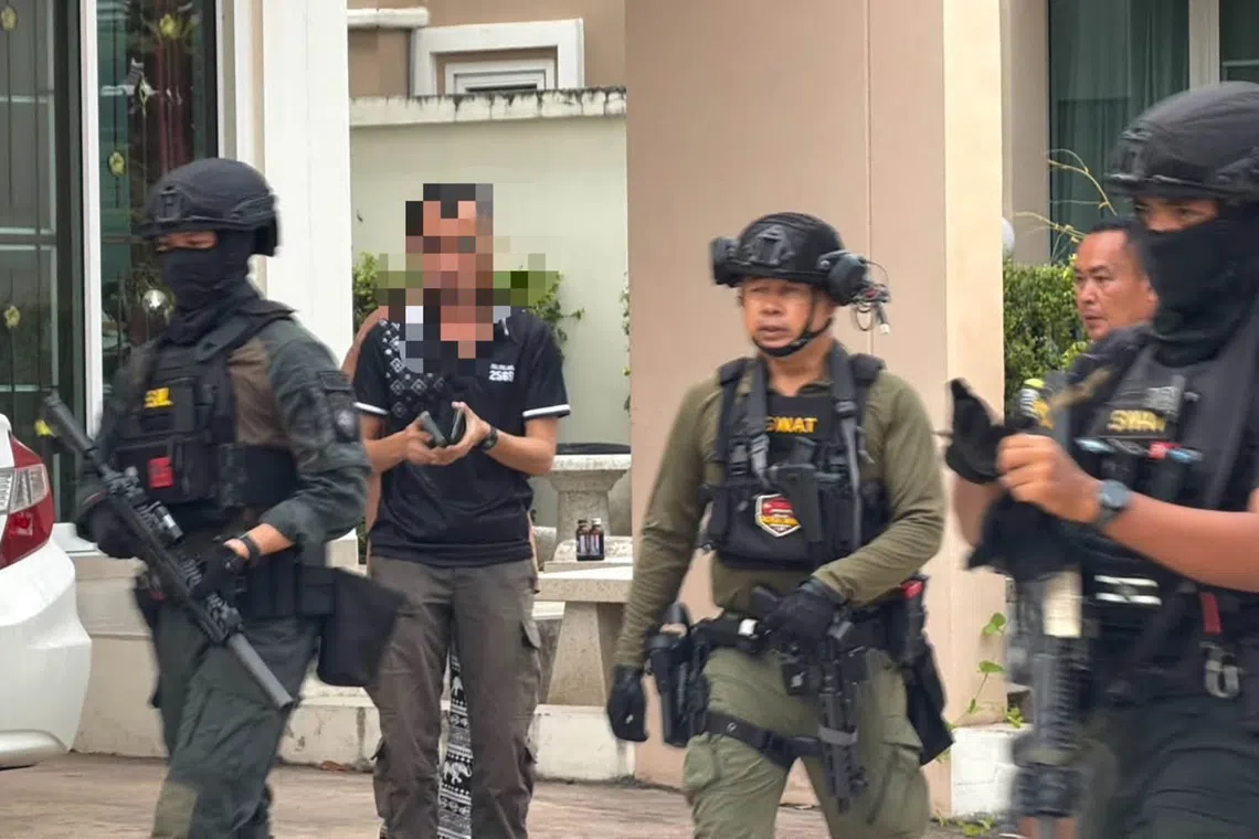 Policeman suspected of killing wife at Thai kindergarten surrenders after 18-hour stand-off
