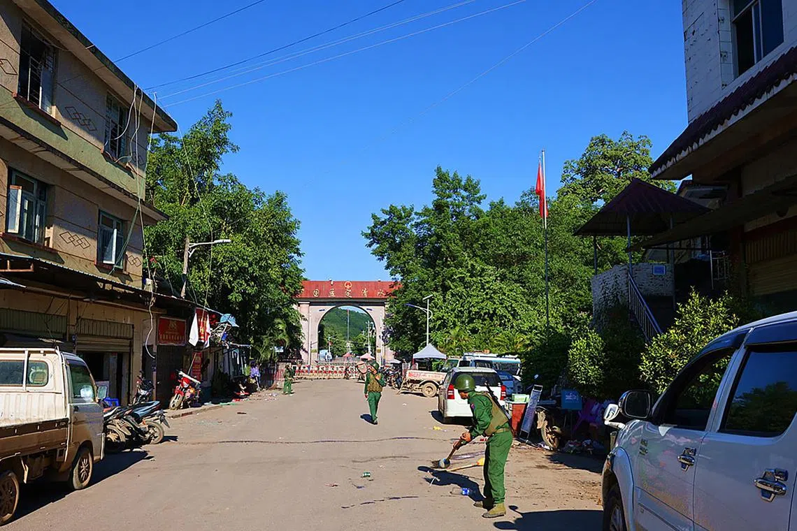 epa10956294 A handout photo made available by the KoKang media shows the Myanmar National Democratic Alliance Army (MNDAA) soldiers clean the road near the border gate in Chinshwehaw, northern Shan State, Myanmar, 29 October 2023 (issued 03 November 2023). Myanmar's military has lost control of Chinshwehaw, a strategic northern town along the border with China, following days of heavy fighting with three ethnic armed groups, according Myanmar military spokesman Zaw Min Tun in a statement on 01 November 2023. Ethnic armed groups the Myanmar National Democratic Alliance Army (MNDAA), the Ta'ang National Liberation Army (TNLA) and the Arakan Army (AA) said they had captured several military outposts and blocked key roads linking Myanmar to China.  EPA-EFE/HANDOUT HANDOUT   HANDOUT EDITORIAL USE ONLY/NO SALES HANDOUT EDITORIAL USE ONLY/NO SALES