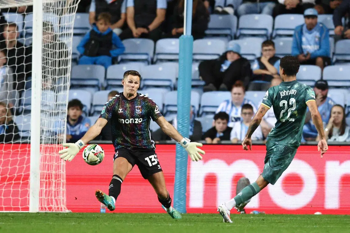 Tottenham Hotspur's Brennan Johnson (right) scores a goal past Coventry City's Ben Wilson at the Coventry Building Society Arena.