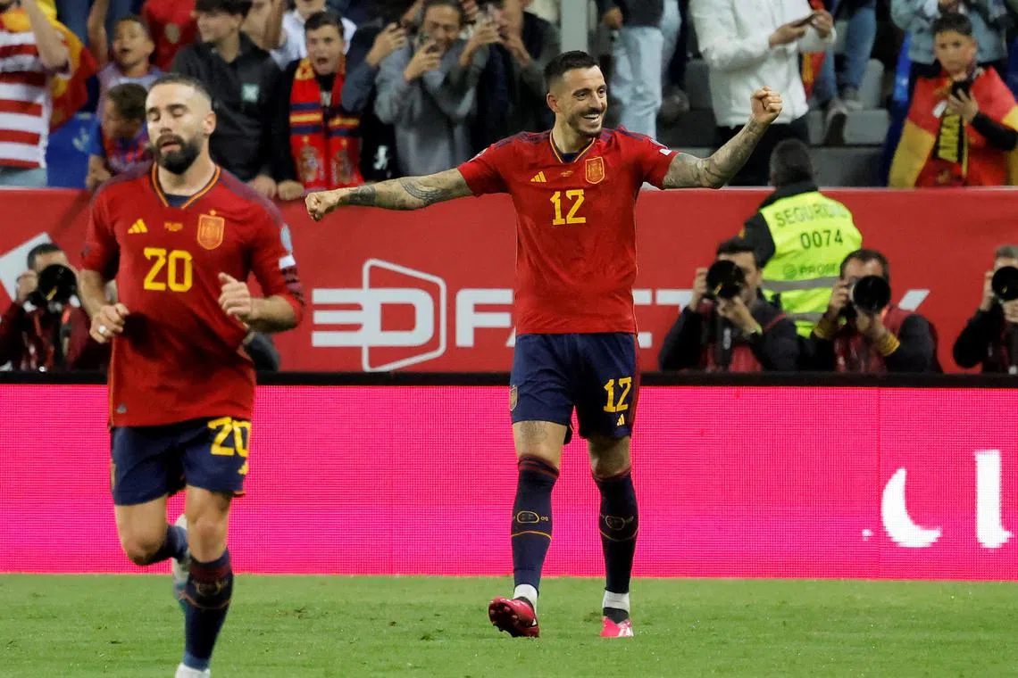 Spain's Joselu celebrates scoring their third goal.