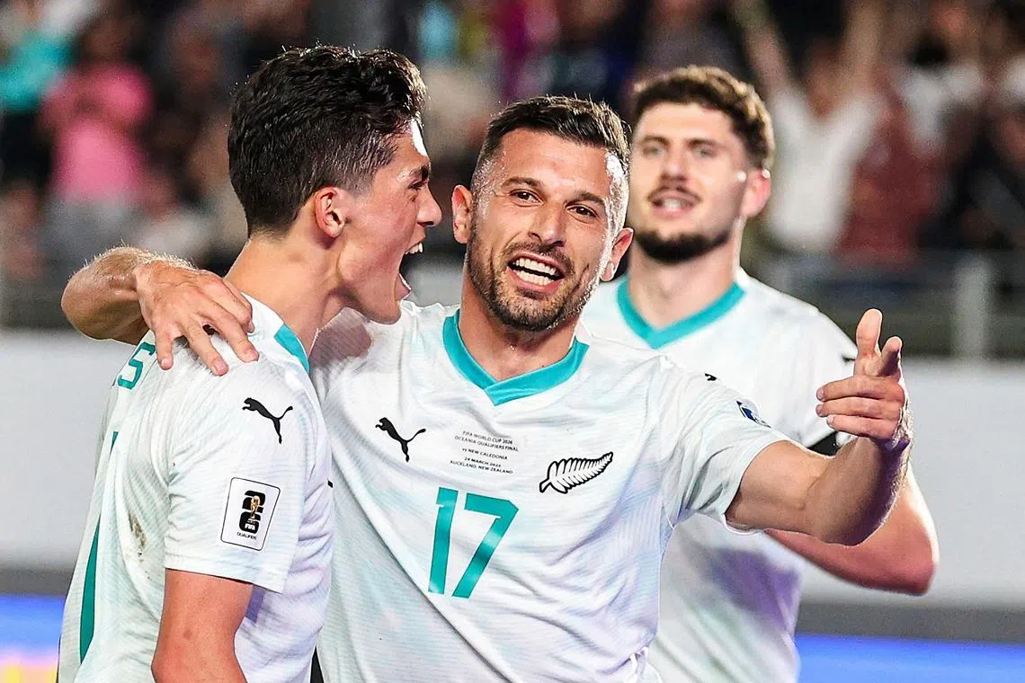 New Zealand’s Kosta Barbarouses (centre) celebrates scoring a goal during the 3-0 win over New Caledonia at Eden Park Stadium in Auckland on March 24. The result secured the All Whites' berth for World Cup 2026.