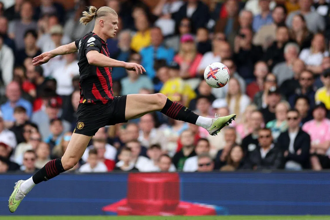 Manchester City's Norwegian striker Erling Haaland controls the ball during the Premier League match against Fulham.