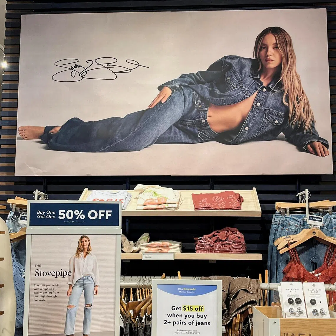 Sydney Sweeney appears in a "good jeans" campaign poster at retailer American Eagle's store in Times Square in New York City, U.S. August 18, 2025.  REUTERS/Sami Marshak
