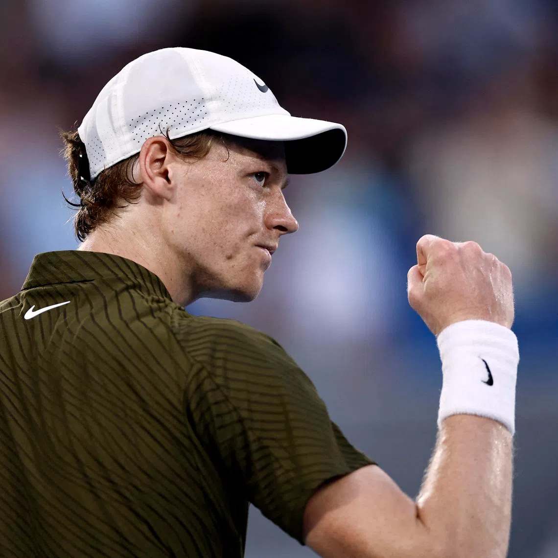 Tennis - Australian Open - Melbourne Park, Melbourne, Australia - January 26, 2026 Italy's Jannik Sinner reacts during his fourth round match against Italy's Luciano Darderi REUTERS/Tingshu Wang