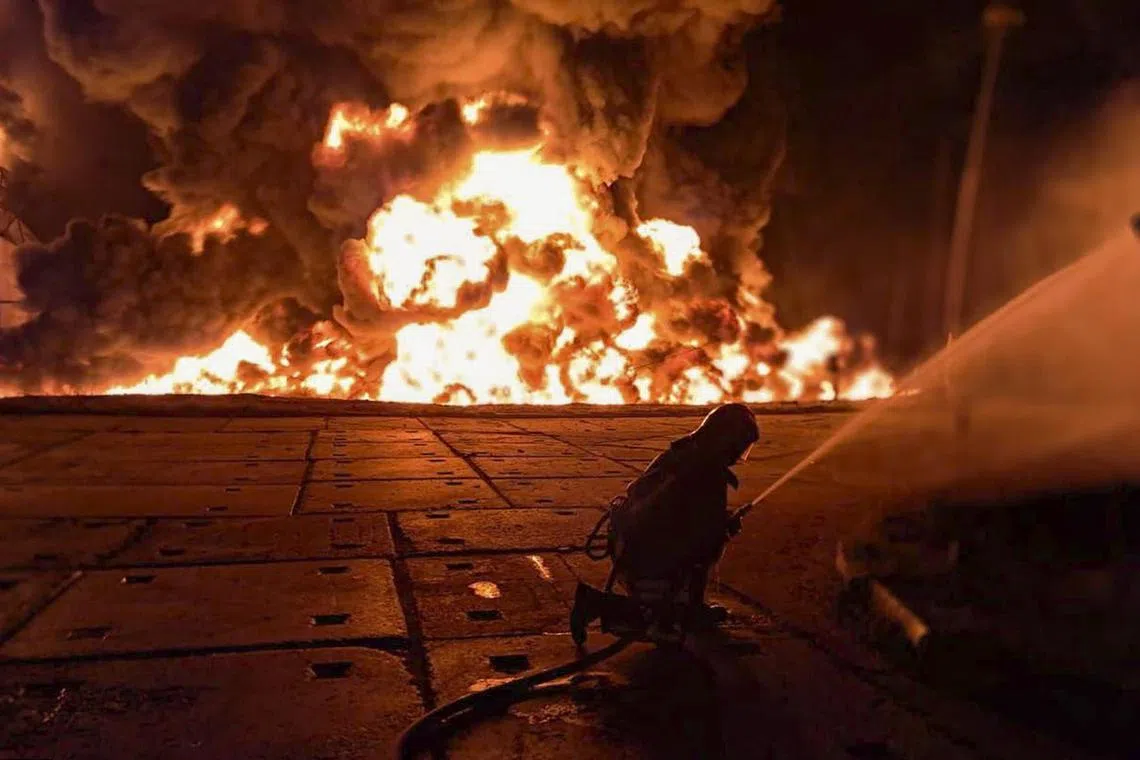 Ukrainian rescuers at the site of a Russian strike on an infrastructure facility near Odesa on Aug 18. 