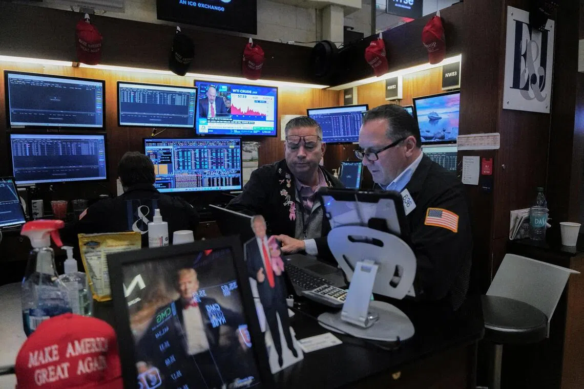 Traders working on the floor of the New York Stock Exchange, in New York City, on Dec 12.