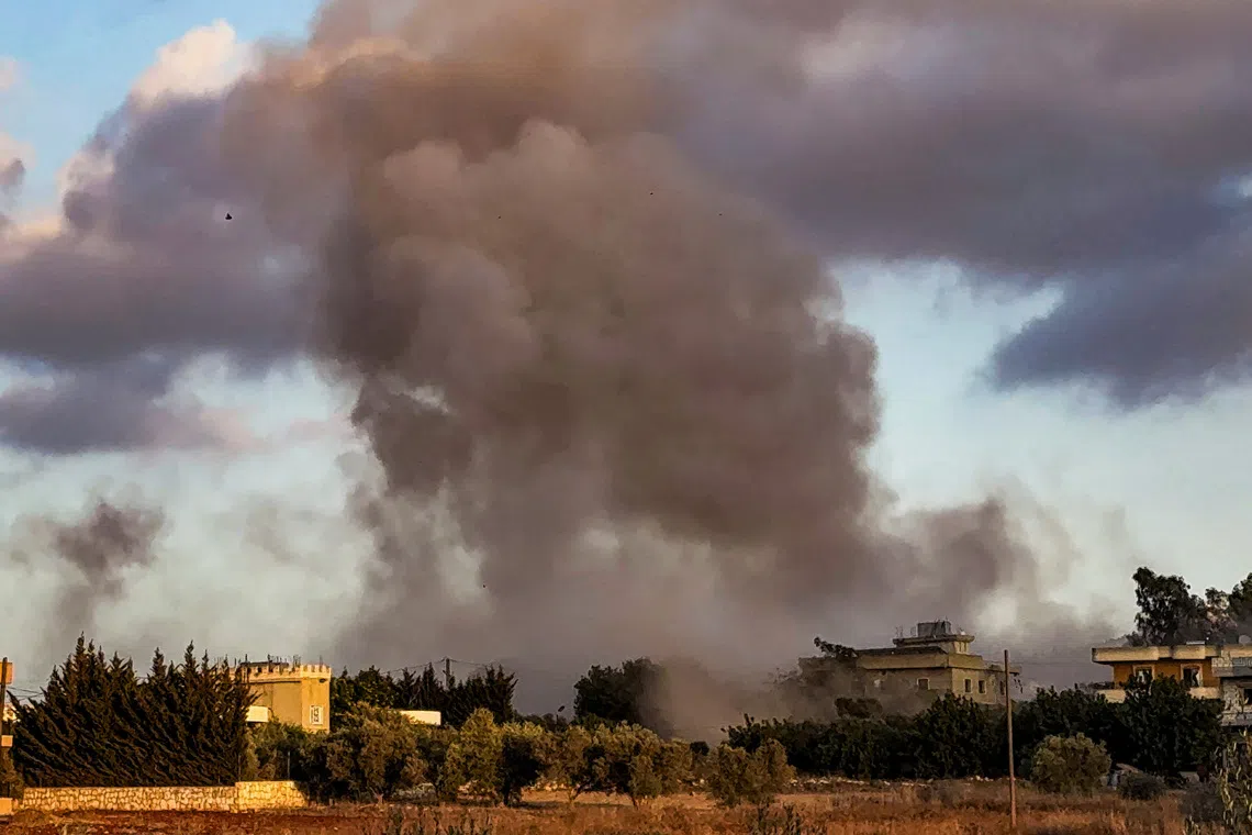 Smoke billows over Kfar Tebnit after an Israeli strike near Lebanon’s border with Israel, in Lebanon, September 18, 2025. REUTERS/Ali Hankir